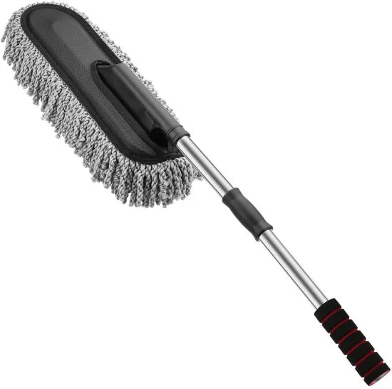 An extendable car cleaning duster featuring a large oval head with grey microfiber chenille noodles and a black backing, attached to a silver metal pole with black foam grips, displayed against a white background.