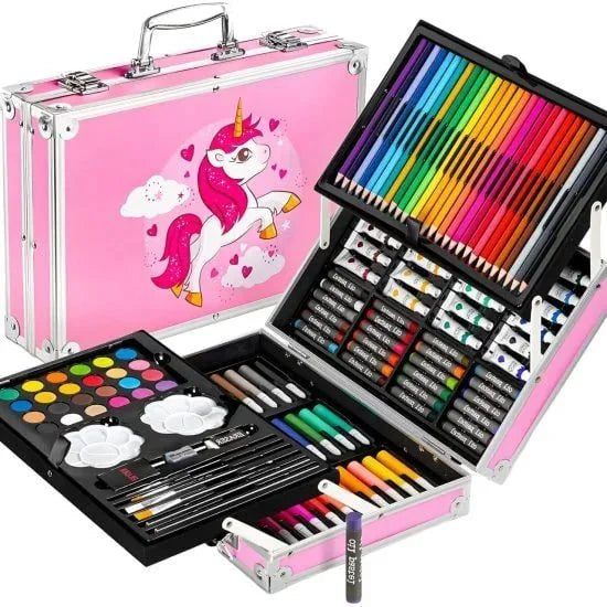 A multi-tiered pink carrying case with a unicorn graphic on the front, opened to reveal a comprehensive 145-piece art set containing colored pencils, watercolor paints, markers, crayons, and brushes.