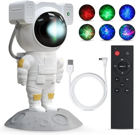 A white astronaut-shaped star projector standing on a grey moon base, displayed alongside its black remote control, USB power cable, and six colorful examples of its galaxy light projections.