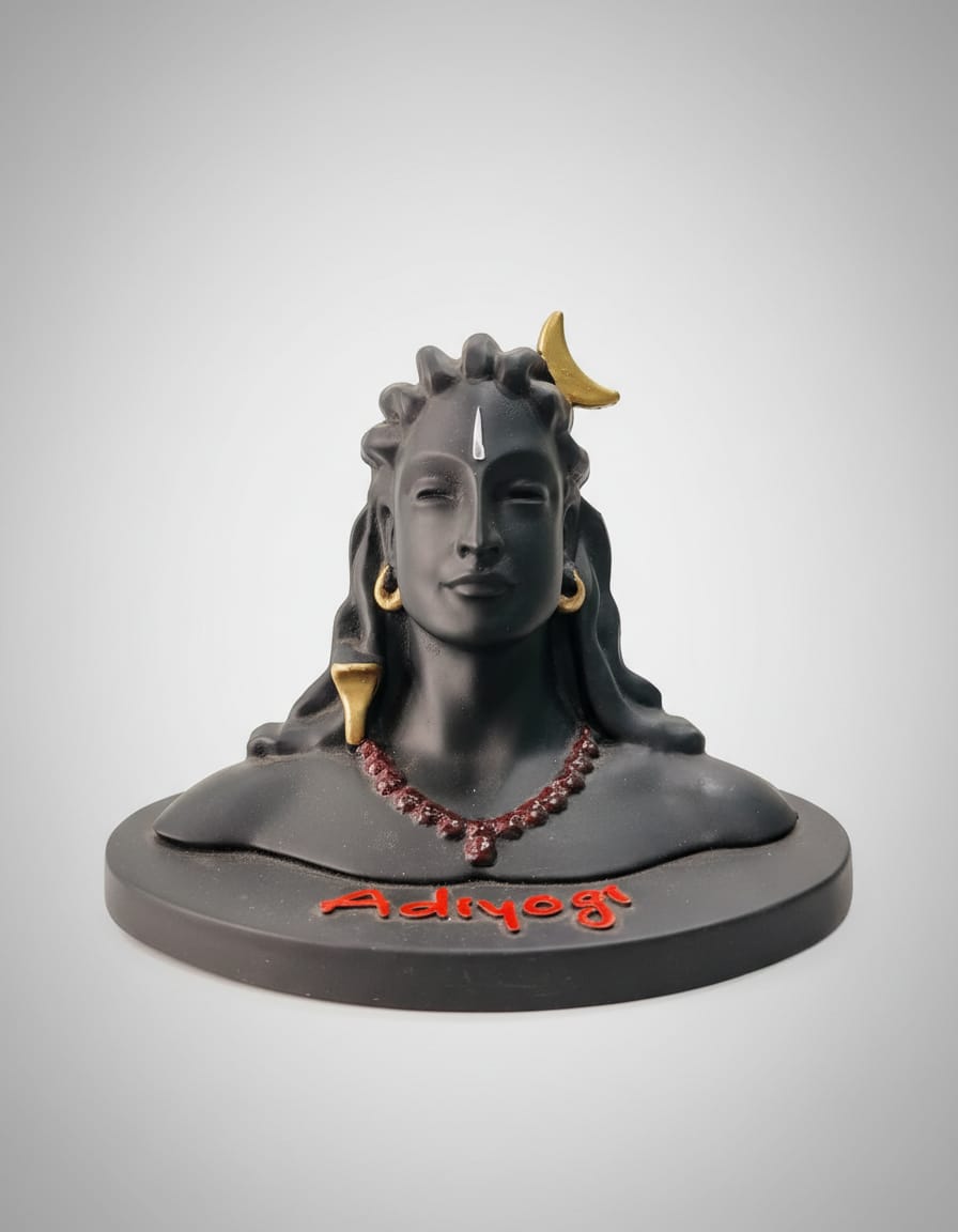 A matte black bust statue of Adiyogi Lord Shiva featuring golden earrings and a crescent moon in his hair, with the word 'Adiyogi' written in red on its circular base.