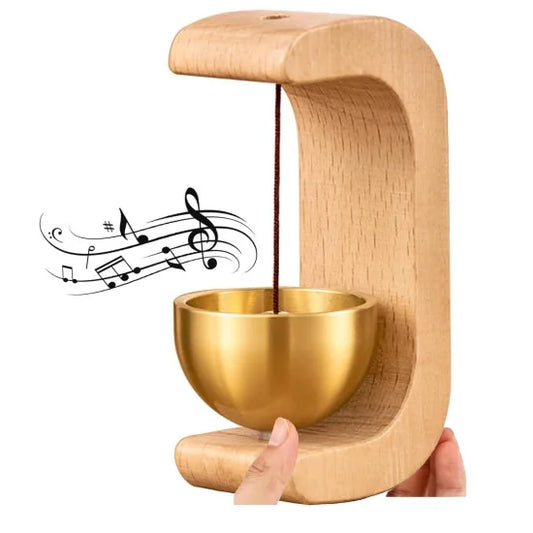 A decorative shopkeeper's doorbell featuring a curved light wood frame and a golden brass chime bowl, with illustrated musical notes floating nearby to indicate a ringing sound.